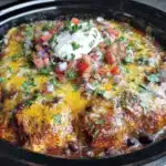 creamy crockpot chicken enchilada casserole - featured image