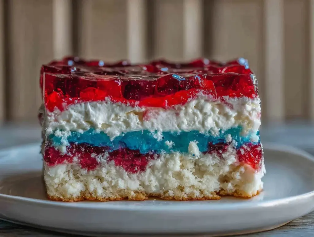 red white and blue layered jello poke cake - featured image